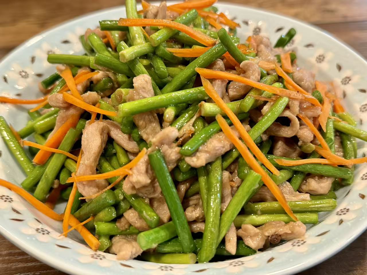 Garlic scapes stir-fried with pork